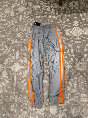 NWT Fashion Nova Women’s Gray Swishy Track Pants with Orange Side Stripes